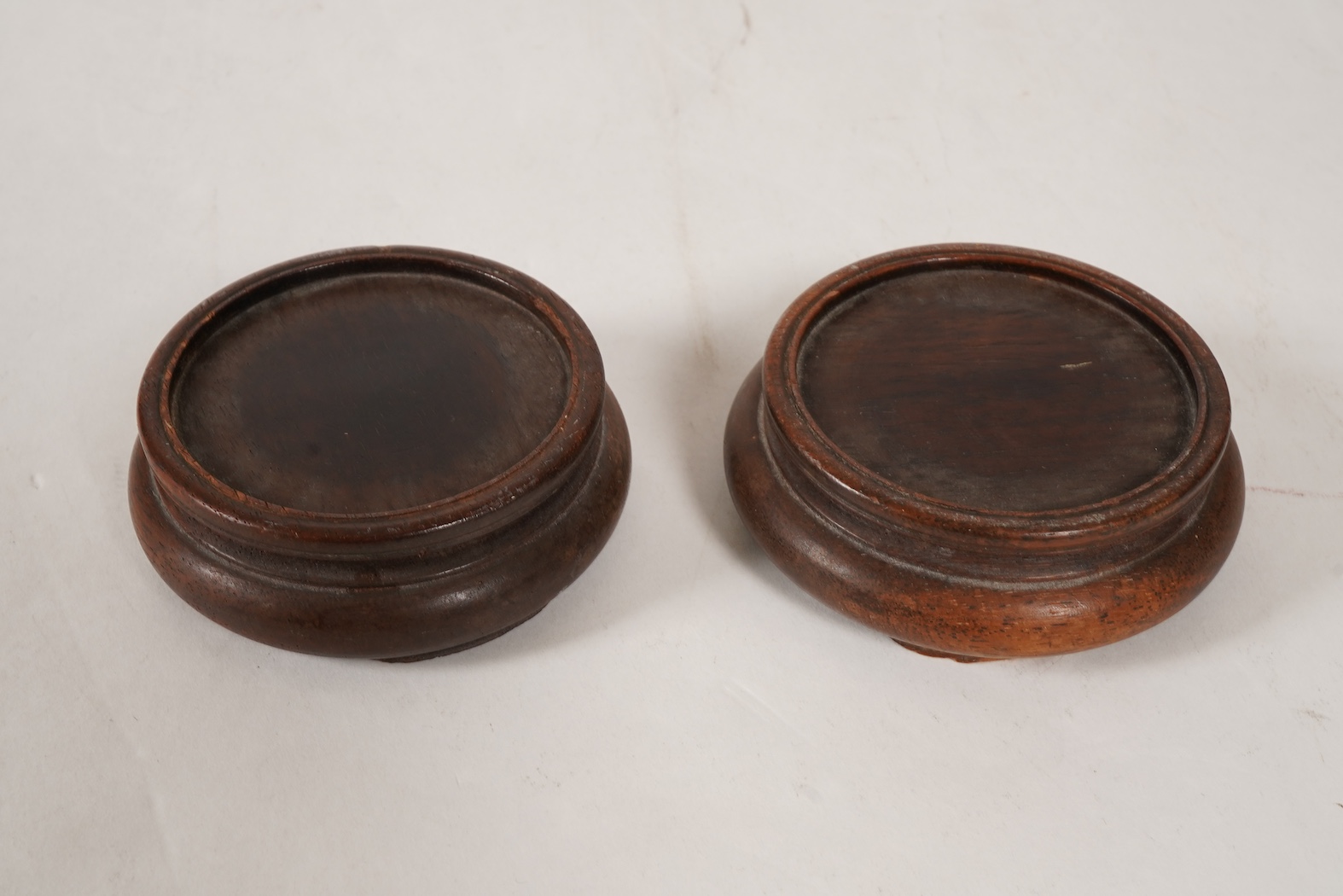 A pair of late 19th/early 20th century Chinese Export white metal two handled globular vases, by Wang Hing, Hong Kong